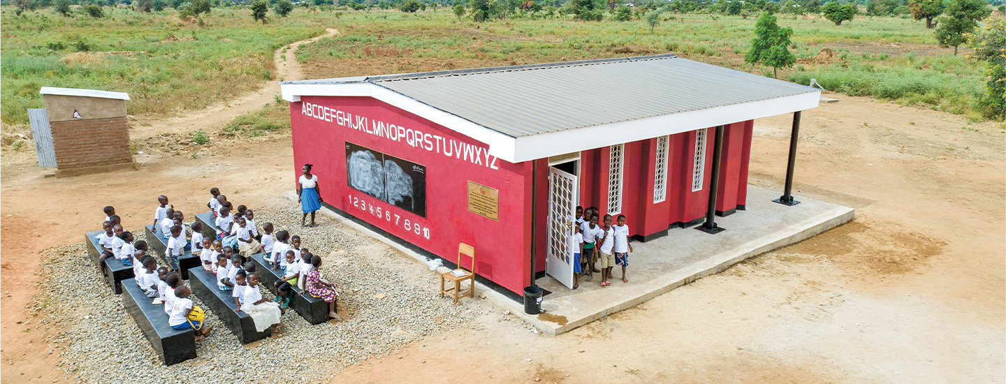 Image of small school with students attending